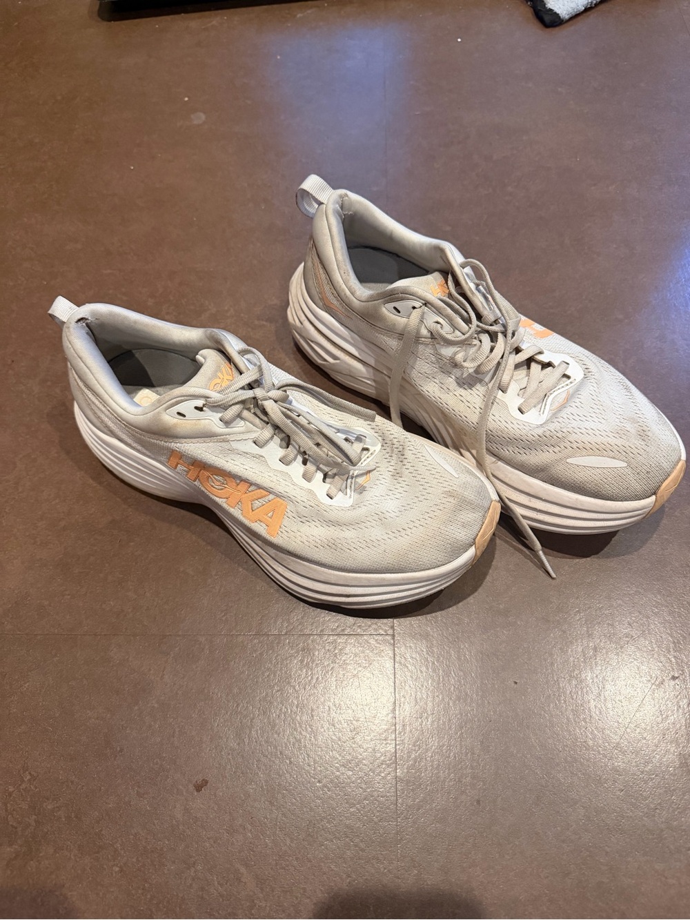 Hoka beige-gray running shoes with peach logo women’s 9.5